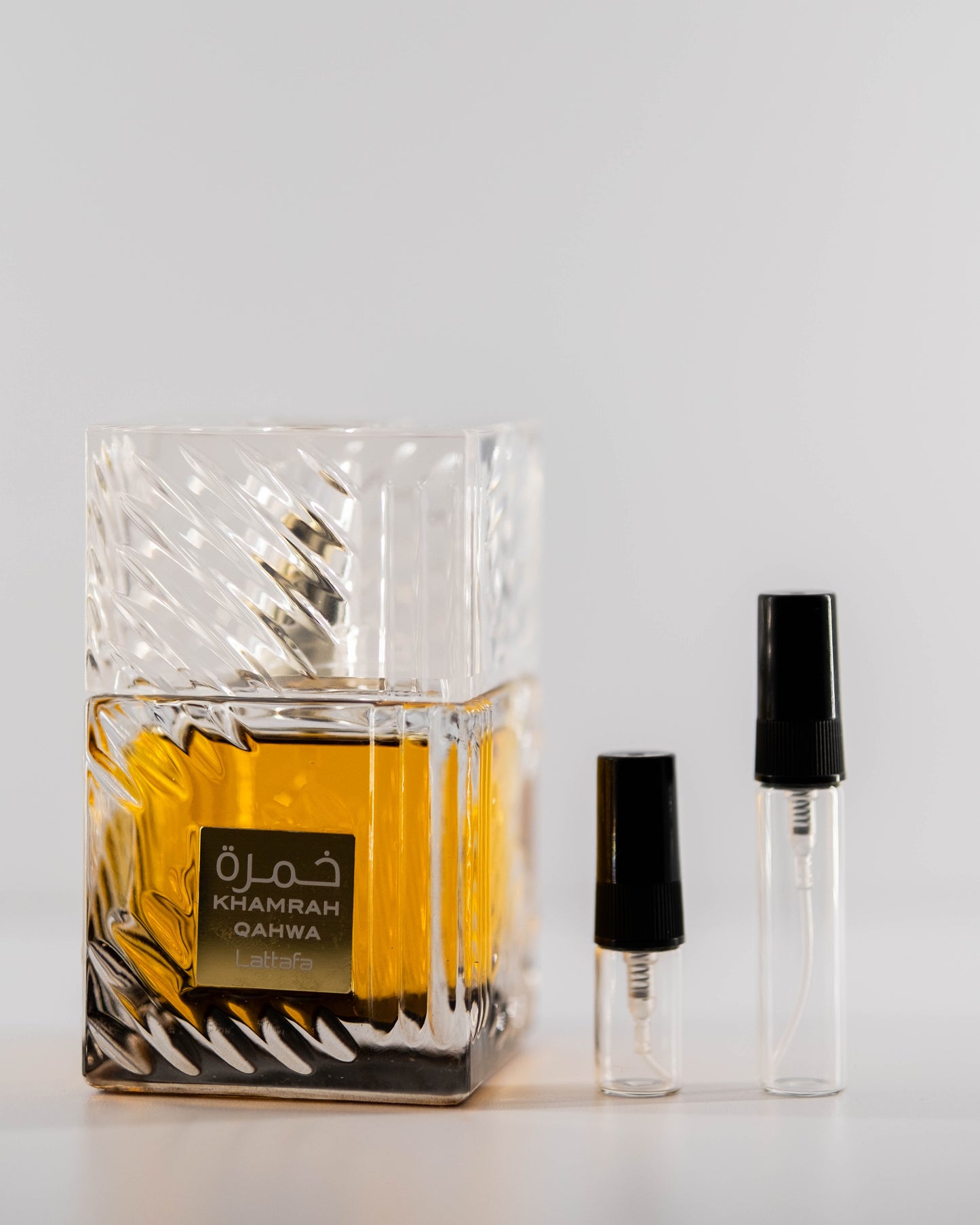 Khamrah Qahwa with 2ml and 5ml decant bottles